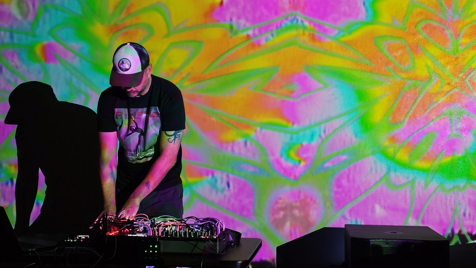 William White performing live — psychedelic backdrop